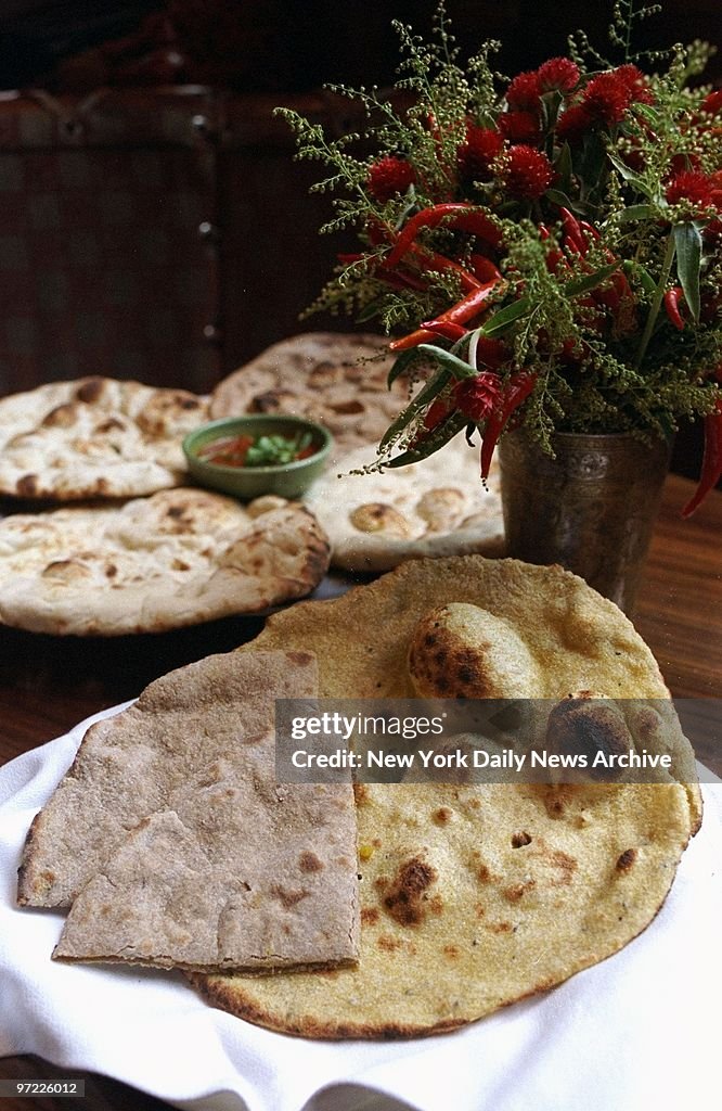 Aloo Parantha (cut bread on left in front) and Mustard Seed