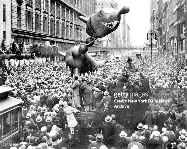 Not-too-ferocious dragon caught fancy of crowd at 1931 Macy's Thanksgiving Day Parade.