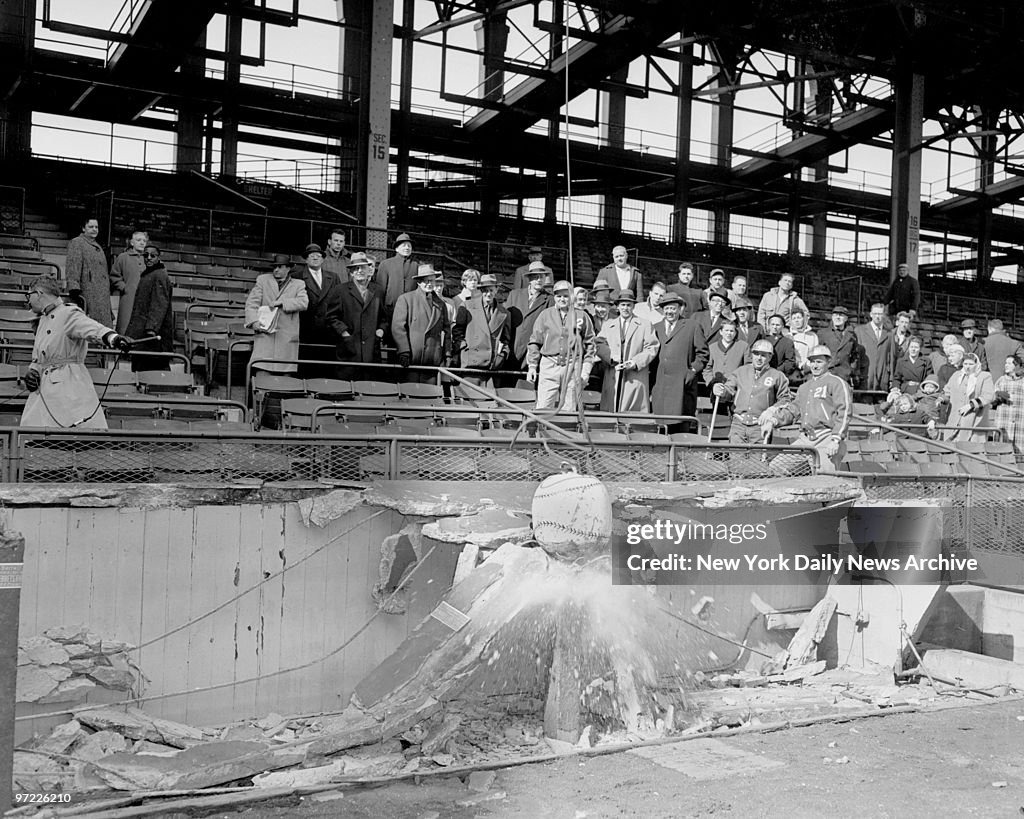 A one-ton wrecking ball, painted to resemble a baseball, thu