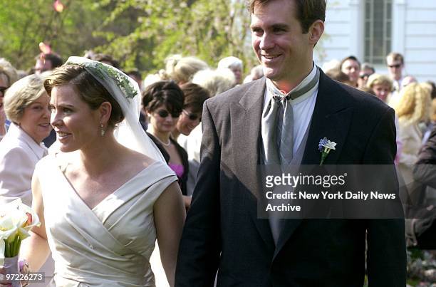 Amanda Kennedy Smith and Carter Hood beam after their wedding at Queen of the Most Holy Rosary Church in Bridgehampton, L.I. Amanda who has a Ph.D....