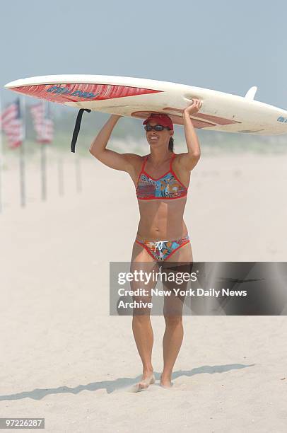 Participant competes in the 21st annual All-Women Lifeguard Tournament on the beach at Sandy Hook, NJ. The competition included racing and rescue...