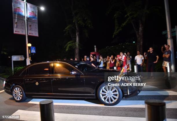 The convoy of North Korean leader Kim Jong Un are pictured on the road as they drive for his departure, in Singapore on June 12, 2018. - Donald Trump...