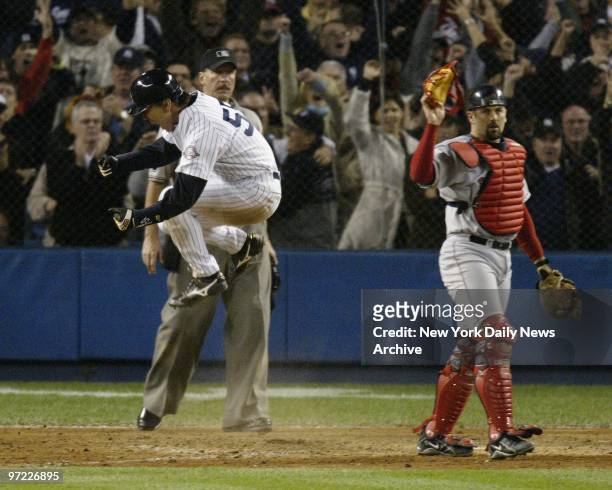 American League Championsip Series Game 7. New York Yankees vs. Boston Red Sox at Yankee Stadium. Hideki Matsui comes home with tying run on Jorge...