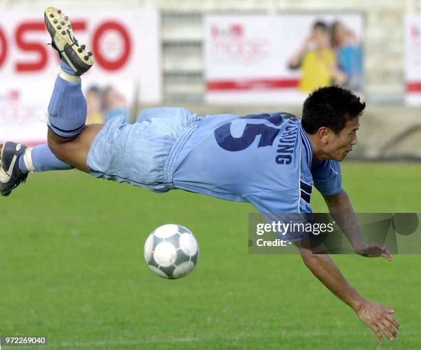 Indian football captain Baichung Bhutia dives in a failed attempt to kick the ball during an exhibition match against Uzbekistan at Ambedkar stadium...