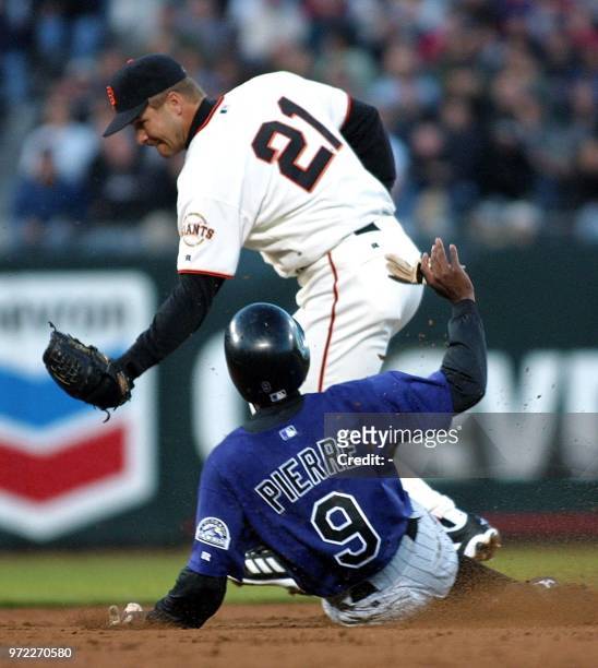 San Francisco Giants second baseman Jeff Kent forces-out Colorado Rockies Juan Pierre at second base during the third inning 24 May 2001 in San...