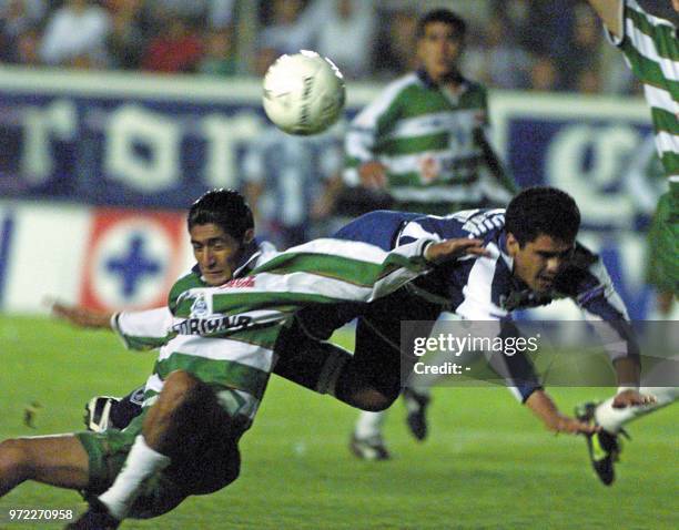 Mikguel Carreon of Santos Laguna fouls Pedro Pineda of Pachuca , in the final match of the Mexican Championship, May 17 2001, in the Hidalgo Pachuca...