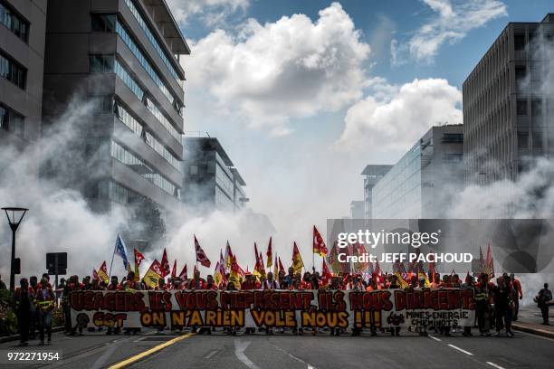 French railway workers demonstrate in Lyon, east-central France, on June 12 on the 15th day of rolling train strikes since April against the planned...