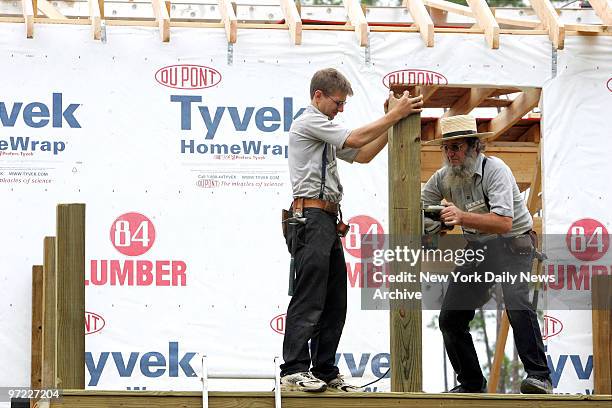 Amish men work to build a new home in Hurricane Katrina-ravaged Waveland, Miss. A group of Amish people arrived from Lancaster County, Penn., on...