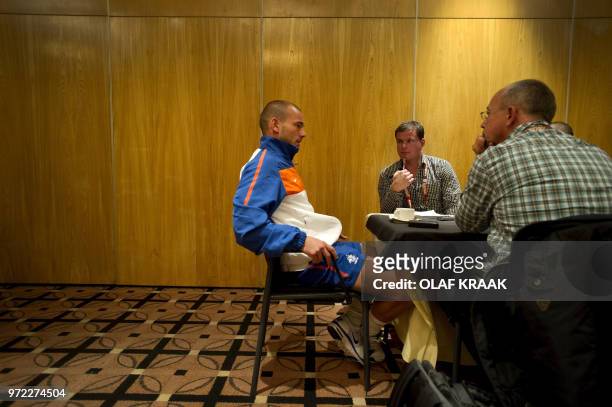 Dutch international football player Wesley Sneijder answers journalists at the Southern Sun hotel in Johannesburg on June 21, 2010. Trainer Bert van...