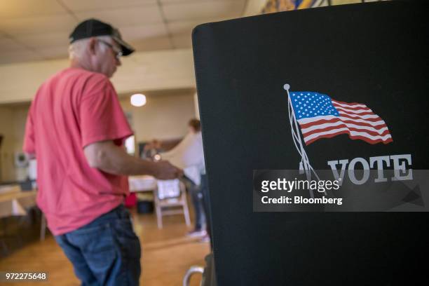 Voter arrives at a booth to fill out ballot at a polling location during the primary election in Lebanon Church, Virginia, U.S., on Tuesday, June 12,...