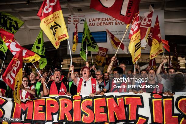 French railway workers demonstrate at Lyon Part Dieu Train Station in Lyon, east-central France, on June 12 on the 15th day of rolling train strikes...