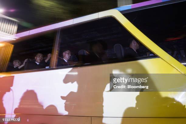 Bus carrying members of North Korean leader Kim Jong Un's delegation drives in a convoy in Singapore, on Tuesday, June 12, 2018. U.S....