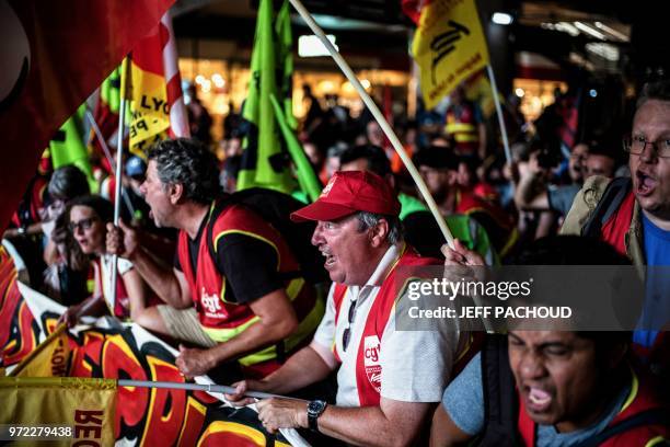 French railway workers demonstrate at Lyon Part Dieu Train Station in Lyon, east-central France, on June 12 on the 15th day of rolling train strikes...