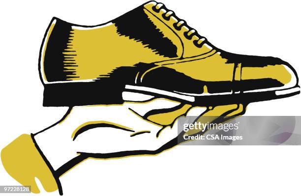 ilustrações de stock, clip art, desenhos animados e ícones de hand holding a shoe - sapatos de homem