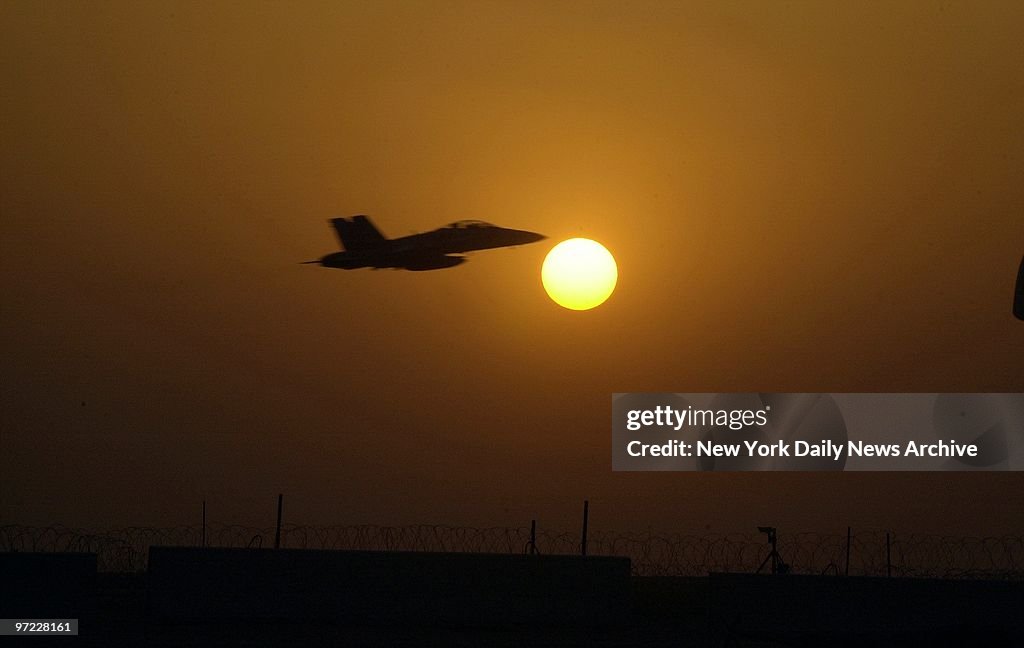 An F-18 fighter flies off to patrol the no-fly zone over Ira