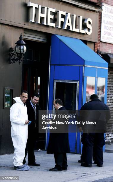 An NYPD detectives outside downtown bar The Falls. Cops gathered bags of evidence inside the building where murder victim Imette St. Guillen was last...