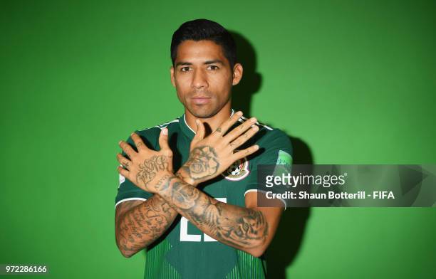 Javier Aquino of Mexico poses for a portrait during the official FIFA World Cup 2018 portrait session at the team hotel on June 12, 2018 in Moscow,...