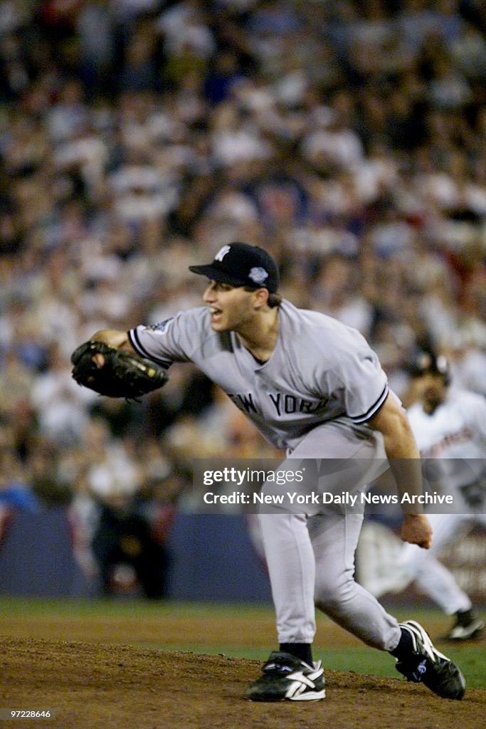 Andy Pettitte of the New York Yankees strikes out Vaugh of t