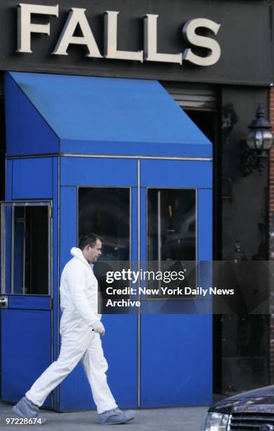 An NYPD forensic detective leaves downtown bar The Falls. Cops gathered bags of evidence inside the building where murder victim Imette St. Guillen...