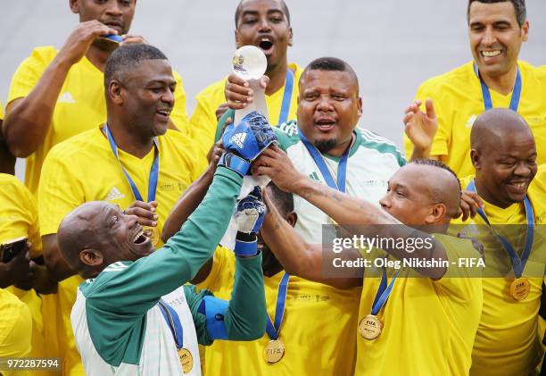 Team lift the trophy during the FIFA Congress Delegation Football Tournament at CSKA Arena during the on June 12, 2018 in Moscow, Russia.