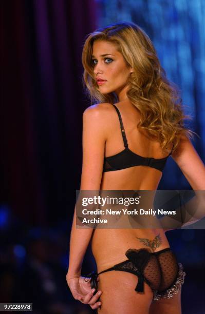 Ana Beatriz Barros models a heart-embellished corset demi and low rise garter panty during the Victoria's Secret Fashion Show at the Lexington Ave....