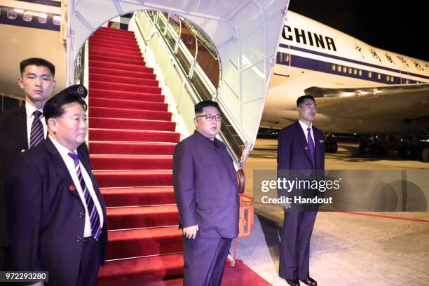 In this handout provided by the Singapore's Ministry of Communications and Information , North Korean leader Kim Jong-un departs Singapore from...