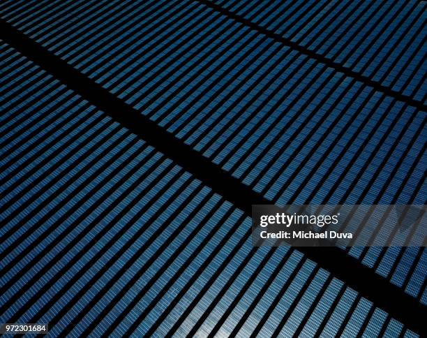 large array of solar panels - baggy green stock pictures, royalty-free photos & images