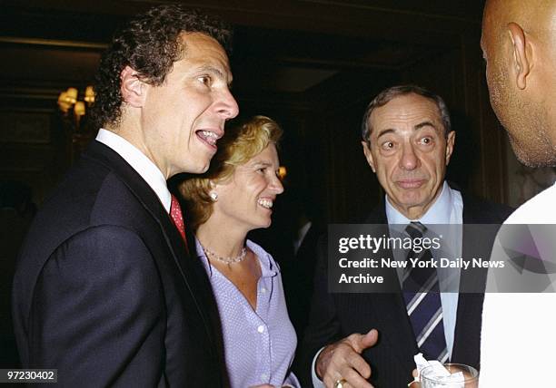 Andrew Cuomo, his wife Kerry Kennedy-Cuomo, and father, former Gov. Mario Cuomo, chat with actor Russell Simmons during a reception for Andrew and...