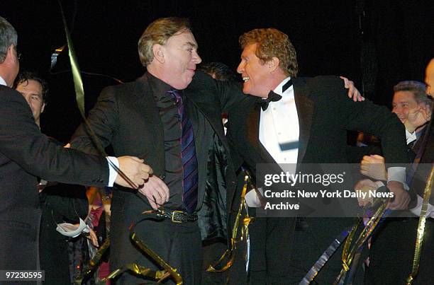 Andrew Lloyd Webber and Michael Crawford embrace following the 7,486th performance of the musical "The Phantom of the Opera" at the Majestic Theatre,...