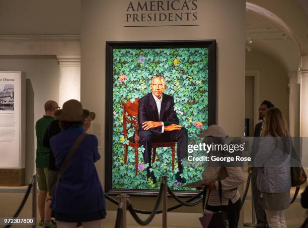 Portrait of President Barack Obama by artist Kehinde Wiley hangs on a wall at the National Portrait Gallery on June 4, 2018 in Washington, D.C. The...