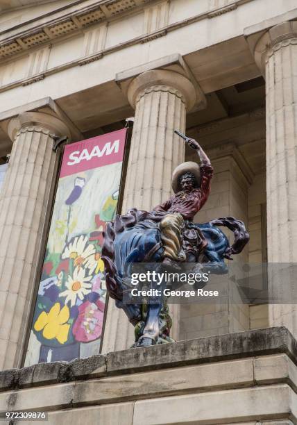 Large sculpture entitled "Vaquero" by artist Luis Jimenez is located outside the east side of the National Portrait Gallery as viewed on June 4, 2018...