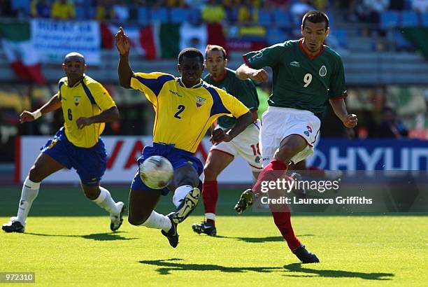 Jared Borgetti of Mexico scores the first goal during the FIFA World Cup Finals 2002 Group G match between Mexico and Ecuador played at the Miyagi...