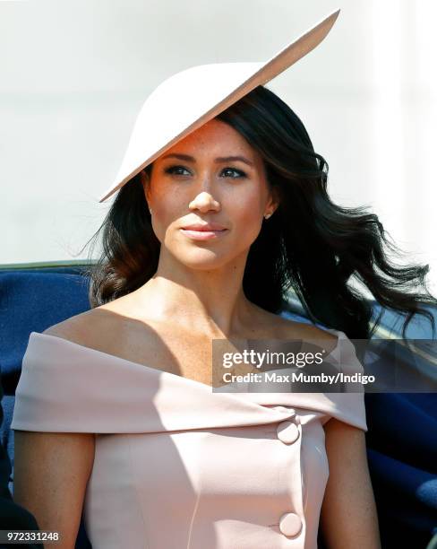 Meghan, Duchess of Sussex travels down The Mall in a horse drawn carriage during Trooping The Colour 2018 on June 9, 2018 in London, England. The...