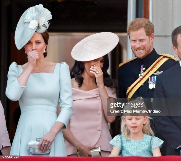 Catherine, Duchess of Cambridge, Meghan, Duchess of Sussex, Prince Harry, Duke of Sussex and Isla Phillips stand on the balcony of Buckingham Palace...