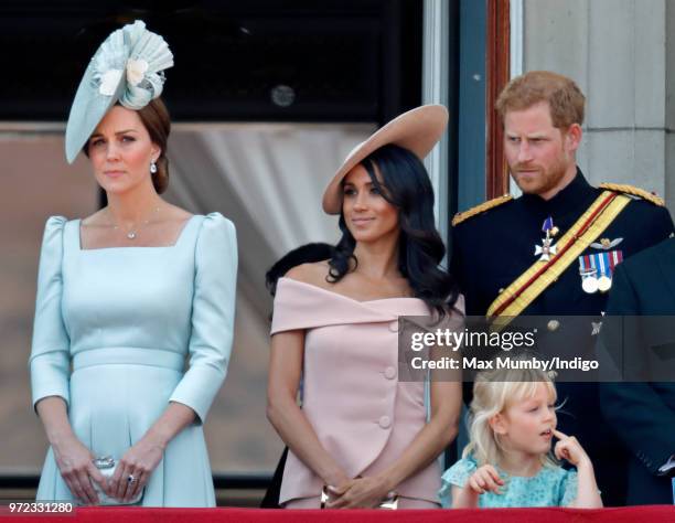 Catherine, Duchess of Cambridge, Meghan, Duchess of Sussex, Prince Harry, Duke of Sussex and Isla Phillips stand on the balcony of Buckingham Palace...