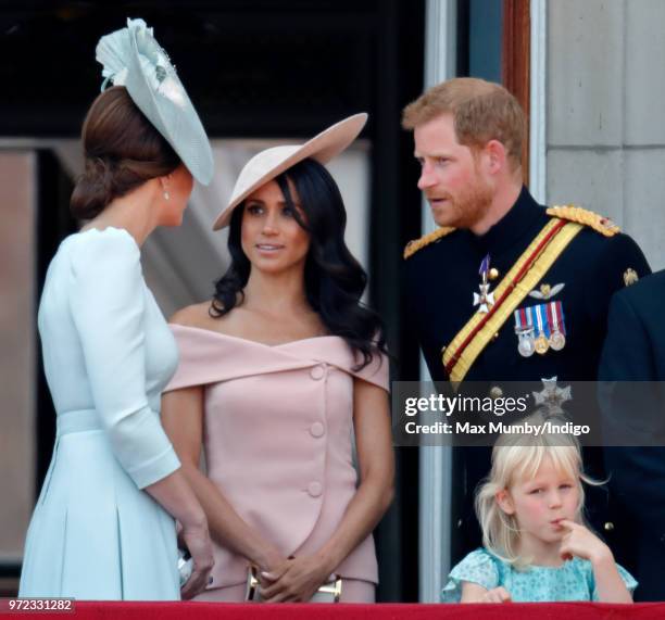 Catherine, Duchess of Cambridge, Meghan, Duchess of Sussex, Prince Harry, Duke of Sussex and Isla Phillips stand on the balcony of Buckingham Palace...