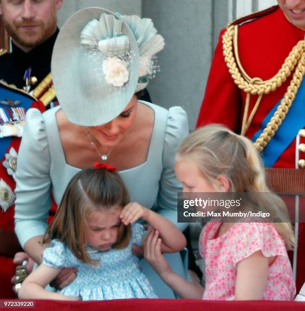 Catherine, Duchess of Cambridge, Princess Charlotte of Cambridge and Savannah Phillips stand on the balcony of Buckingham Palace during Trooping The...