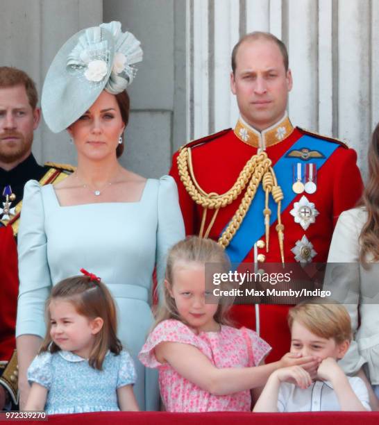 Catherine, Duchess of Cambridge, Princess Charlotte of Cambridge, Prince William, Duke of Cambridge and Savannah Phillips stand on the balcony of...