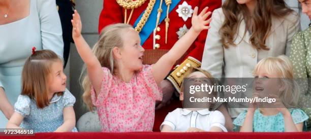 Princess Charlotte of Cambridge, Savannah Phillips, Prince George of Cambridge and Isla Phillips stand on the balcony of Buckingham Palace during...