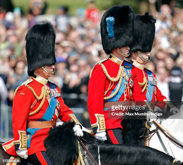 Prince Charles, Prince of Wales, Prince William, Duke of Cambridge and Prince Andrew, Duke of York ride on horseback down The Mall during Trooping...