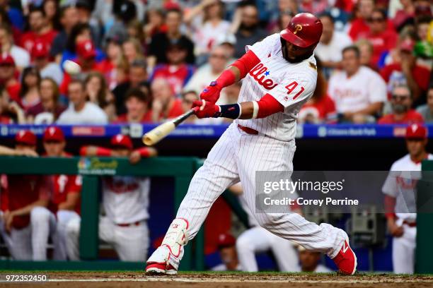 Carlos Santana of the Philadelphia Phillies connects against the Milwaukee Brewers during the first inning at Citizens Bank Park on June 8, 2018 in...