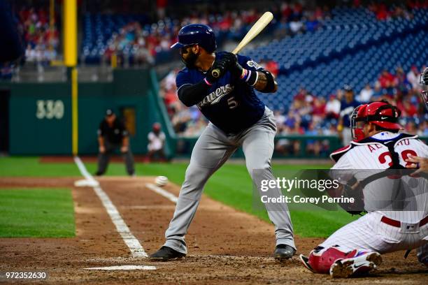 Jonathan Villar of the Milwaukee Brewers bats as Jorge Alfaro of the Philadelphia Phillies catches during the third inning at Citizens Bank Park on...