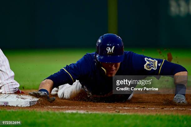 Christian Yelich of the Milwaukee Brewers makes his way back to first base during the fourth inning against the Philadelphia Phillies at Citizens...