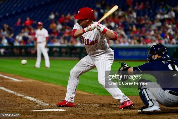 Andrew Knapp of the Philadelphia Phillies eyes a pitch during the seventh inning against the Milwaukee Brewers at Citizens Bank Park on June 8, 2018...