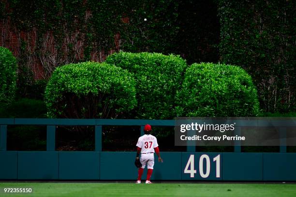 Odubel Herrera of the Philadelphia Phillies looks at a home run hit by Christian Yelich of the Milwaukee Brewers during the eighth inning at Citizens...