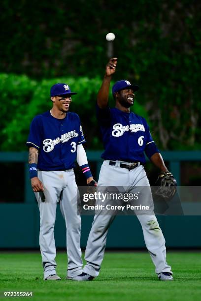 Lorenzo Cain of the Milwaukee Brewers smiles after making a catch Orlando Arcia of the Milwaukee Brewers could not handle against the Philadelphia...