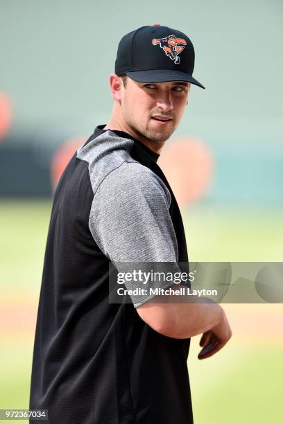 Andrew Susac of the Baltimore Orioles looks on during batting practice of a baseball game against the New York Yankees at Oriole Park at Camden Yards...