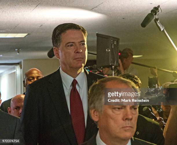 James Wolfe former director of security with the Senate Intelligence Committee escorts former FBI Director James Comey out of hearing room in the...
