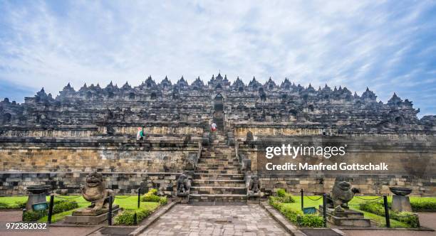 eastern ascend to step pyramid of 9th century borobudur buddhist temple, borobudur archaeological park; central java, indonesia - borobudur stock-fotos und bilder