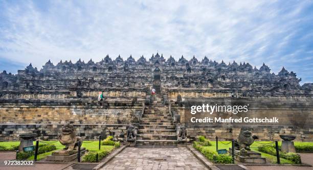 eastern ascend to step pyramid of 9th century borobudur buddhist temple, borobudur archaeological park; central java, indonesia - borobudur temple stock pictures, royalty-free photos & images